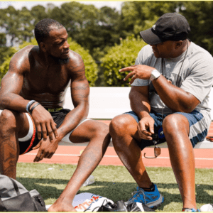 Olympic Speed and Power Coach Kyle Meadows is discussion with an athlete